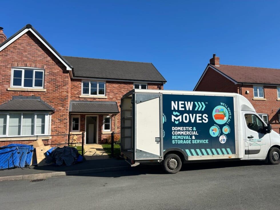 Two New Moves Removals team members preparing equipment ahead of a customer move