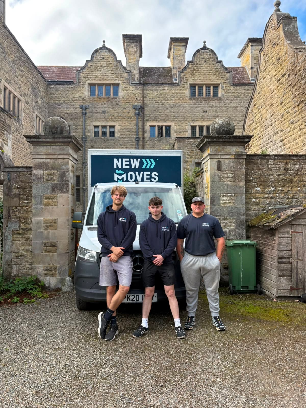 New Moves Removals team members outside a grand stone manor house