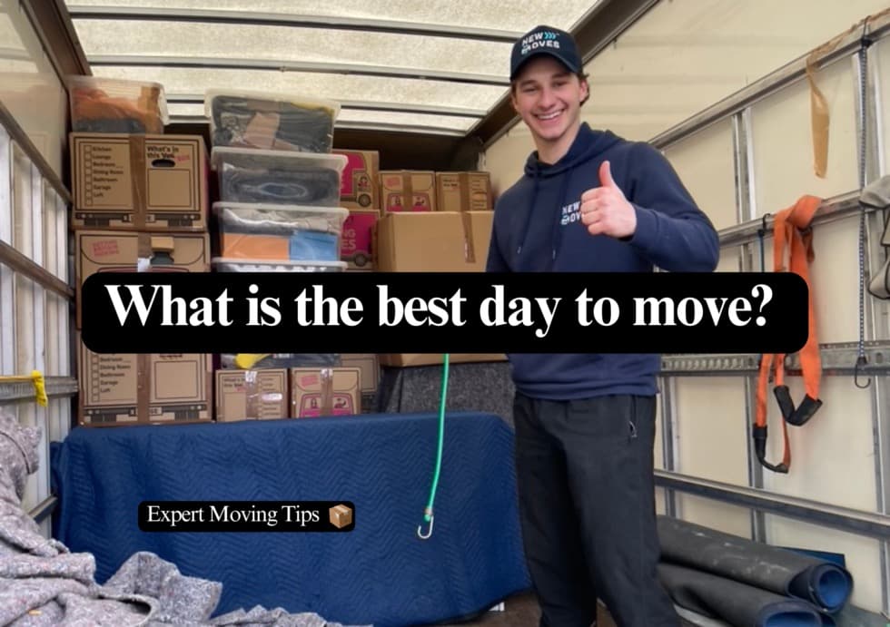A New Moves Removals team member giving a thumbs up inside a removal van loaded with boxes