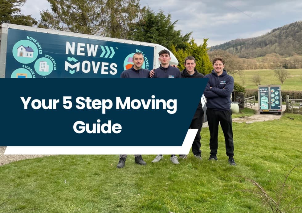 New Moves Removals team standing beside a branded sign reading Your 5 Step Moving Guide, in a countryside setting