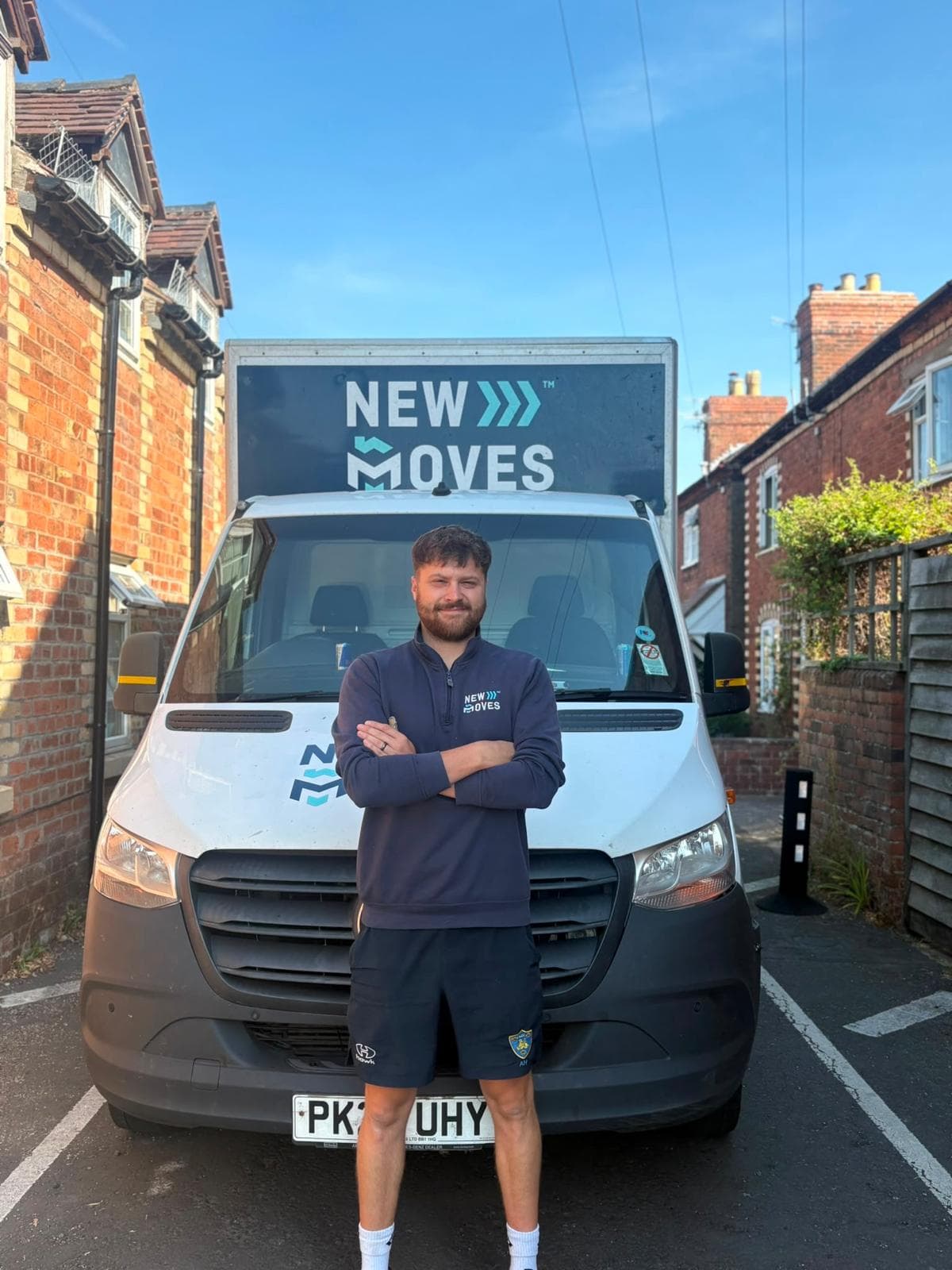 A New Moves Removals van parked beside a stone farmhouse